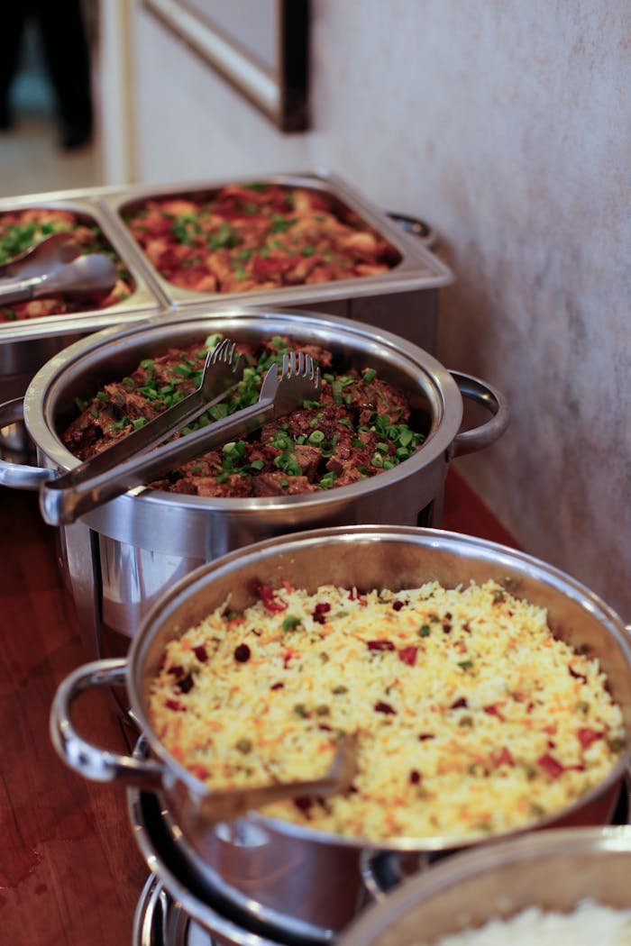 Crafting Captivating Headlines: Your awesome post title goes here An enticing buffet setup with various delicious dishes served in stainless steel trays, perfect for catering events.